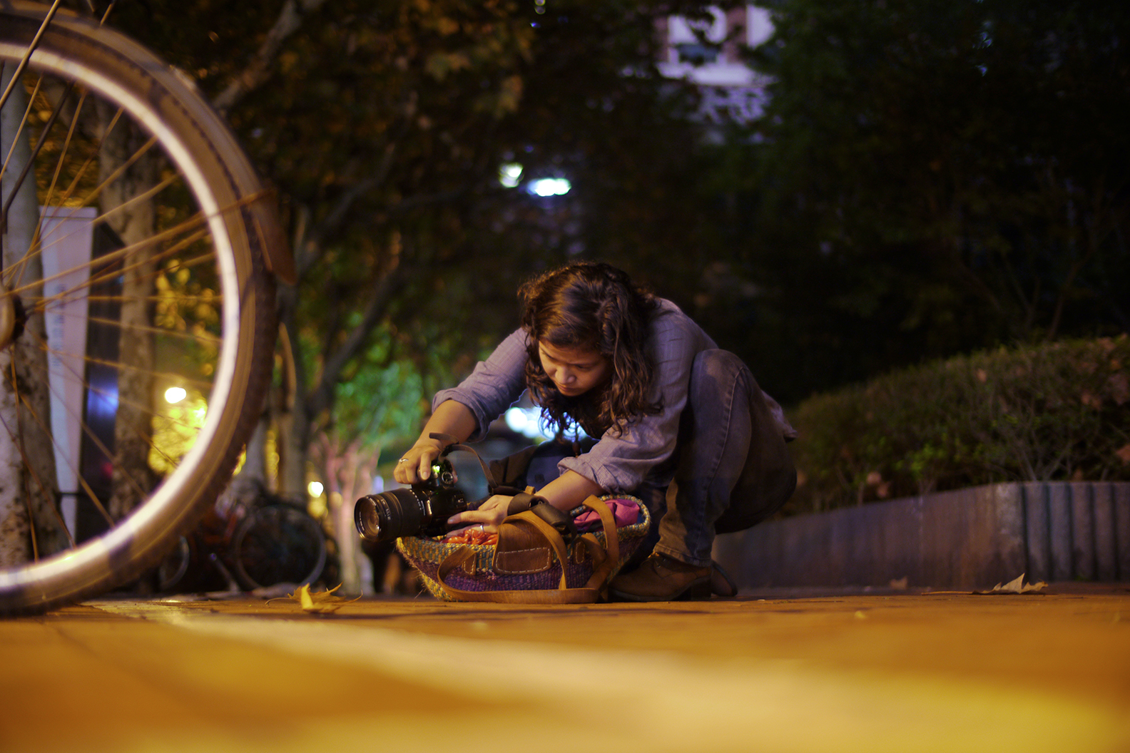 A student finding stability with her own method during a night shooting session