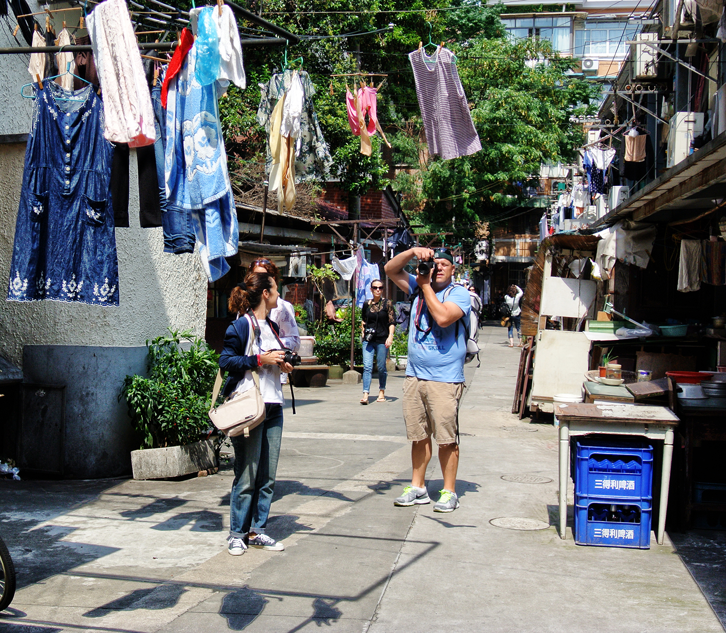 Dominant blue; drying clothes, jacket, jeans, shirt, boxes and... sky